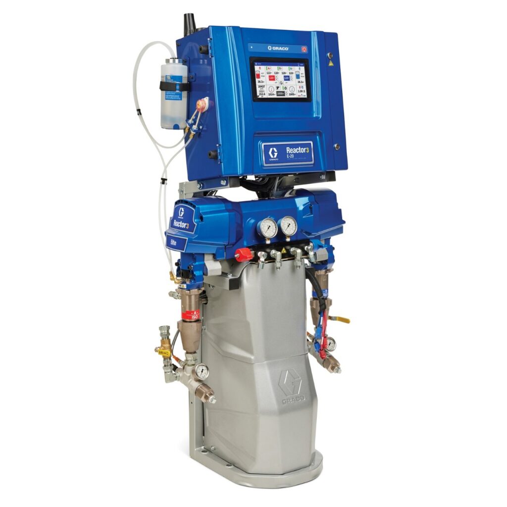 A compact, upright Graco Reactor 3 E‑20 Elite spray foam proportioner features a durable metal frame, integrated touchscreen control panel, side‑mounted hose and electrical connectors, and a protected lower section housing pumps and system components. The unit has a clean, industrial design optimized for contractor spray foam applications.